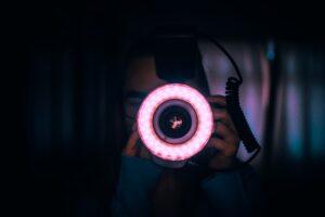 A purple ring light around a camera's lens